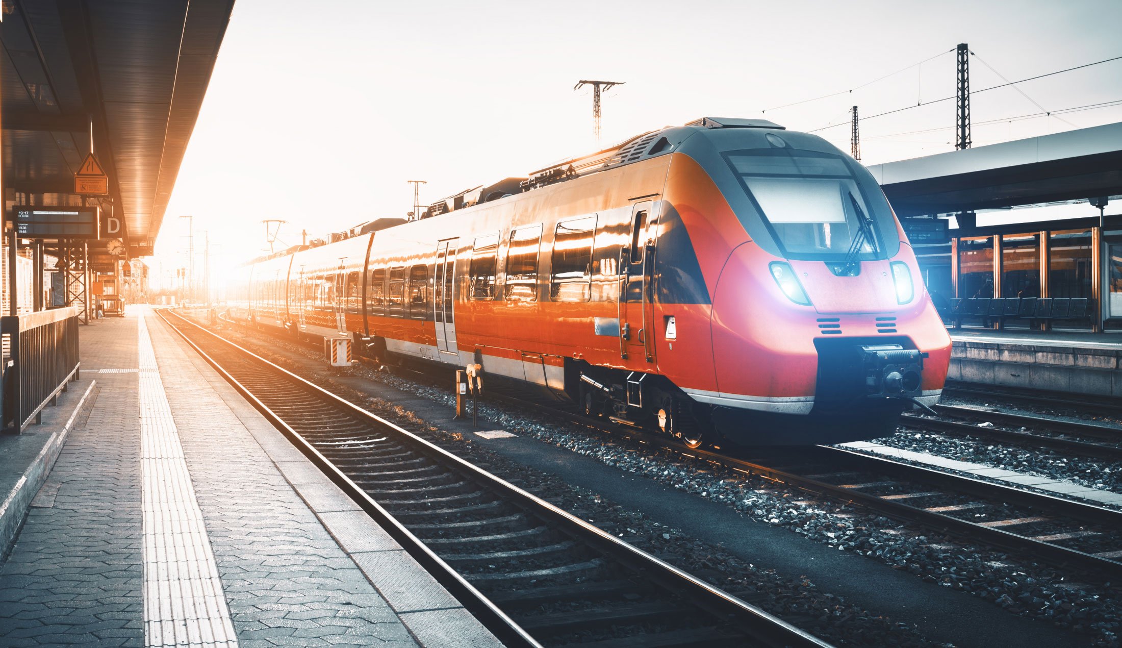 Train at a platform at a railway station.