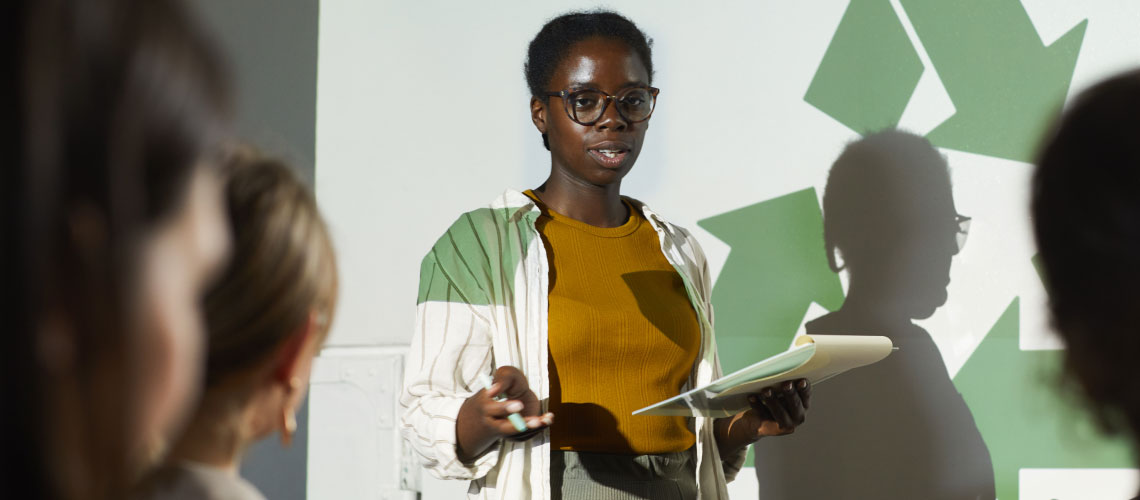 Woman presenting in front of an audience