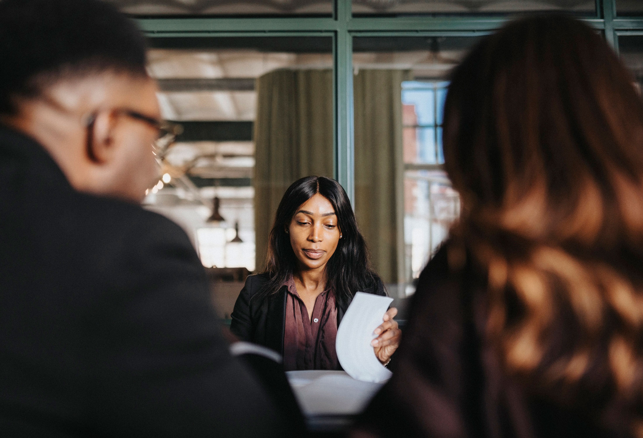 Couple talking with their bank contact