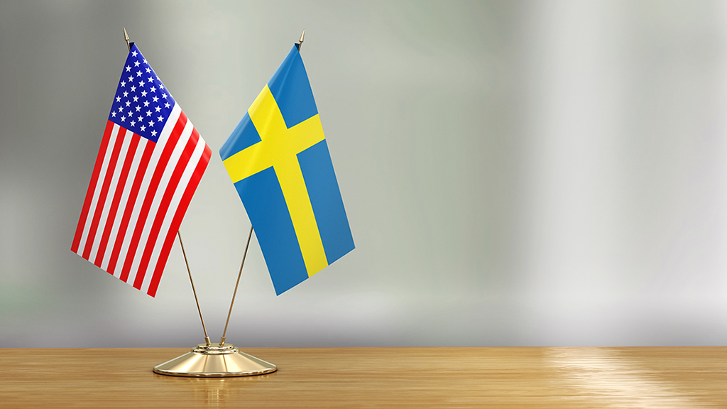 Sweden's and USA's flags on a table