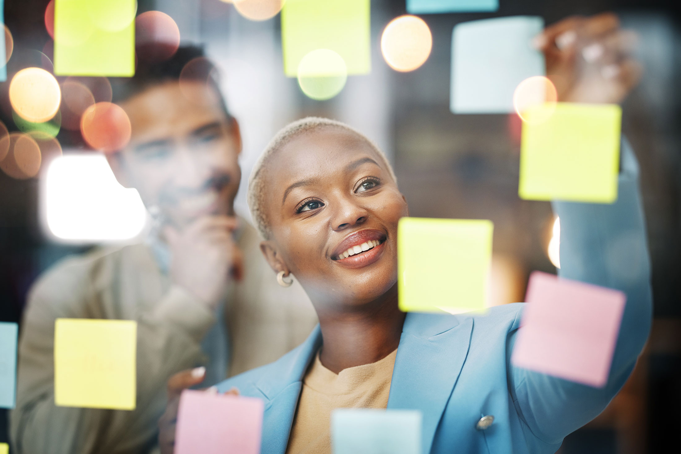 Woman brainstorming with colourful notes