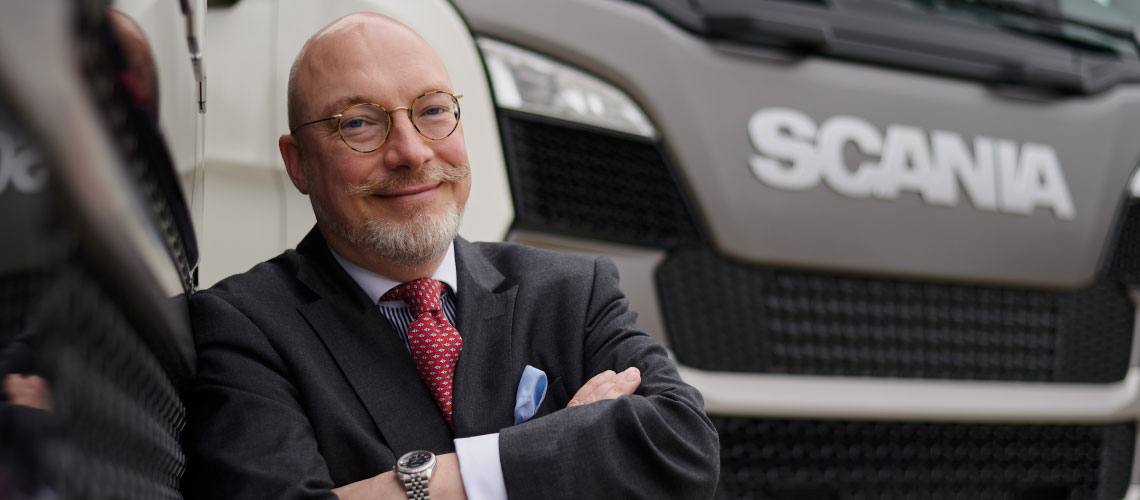 Håkan Jyde in front of a Scania truck